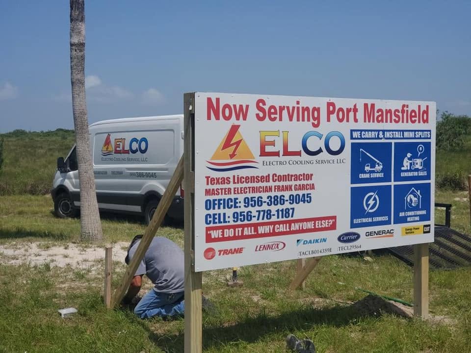 Electro Cooling Service "Now Serving Port Mansfield" sign with an ELCO van on the Texas coast