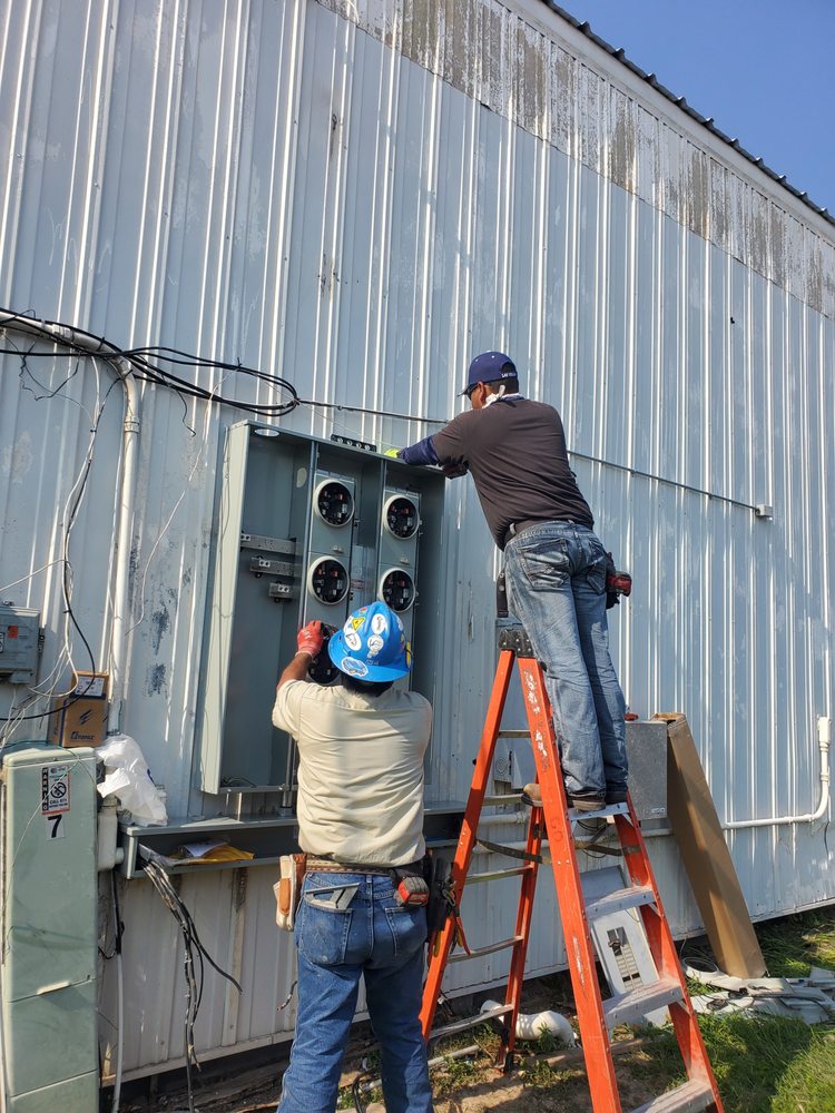 Electro Cooling Service crew on a commercial HVAC and electrical job — serving San Juan, TX
